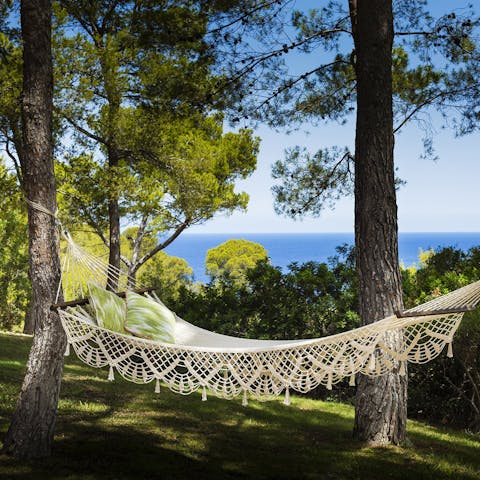 Sway on a hammock under the trees while the Mediterranean sparkles in the distance