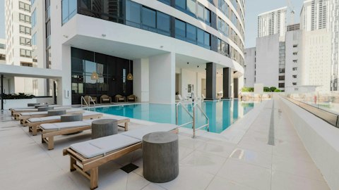 Cool off in the communal pool surrounded by the Downtown Miami skyline