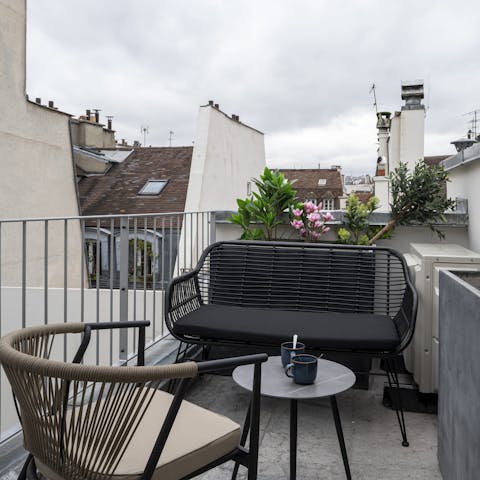 Take in the views over the City of Light's rooftops from the private terrace