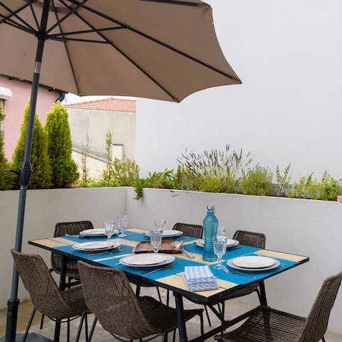 Enjoy some red wine with authentic food on the balcony