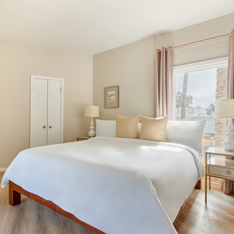 Wake up to palm trees swaying right outside your window