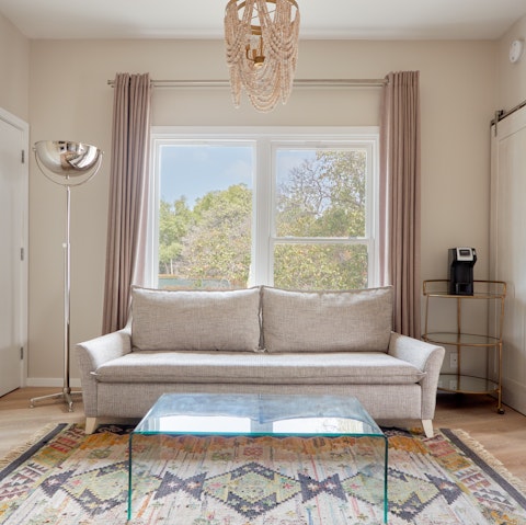 Kick back in the bright living area with your morning coffee while catching up on the news