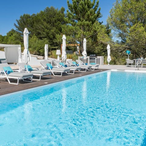 Lie out by the crystalline swimming pool