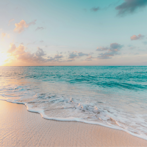 Watch the sunset on Hapuna Beach, a short drive away
