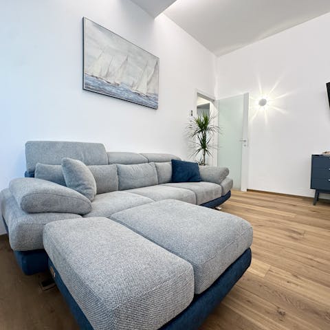 Unwind in the open plan living room after a beach day