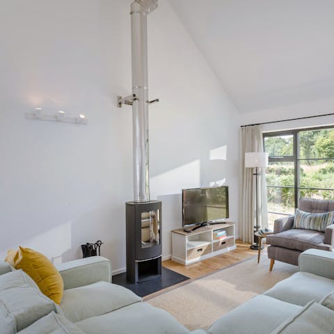 Relax around the wood burner after a long day meandering in the surrounding fields