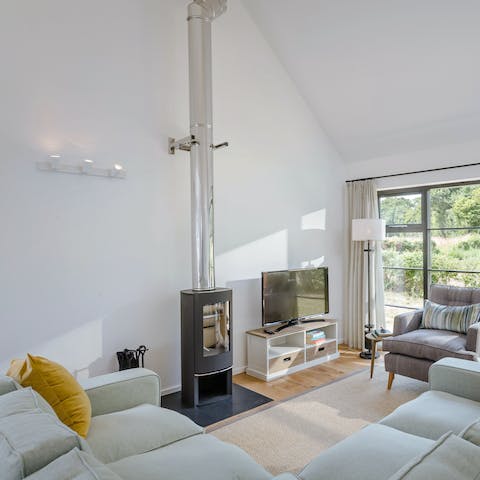 Relax around the wood burner after a long day meandering in the surrounding fields