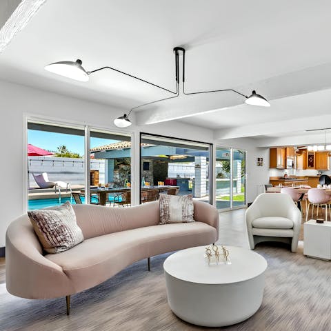 Blend indoor and outdoor living by sliding open the glass doors