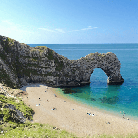 Feel the sand between your toes at the iconic Durdle Door beach