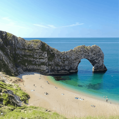 Feel the sand between your toes at the iconic Durdle Door beach