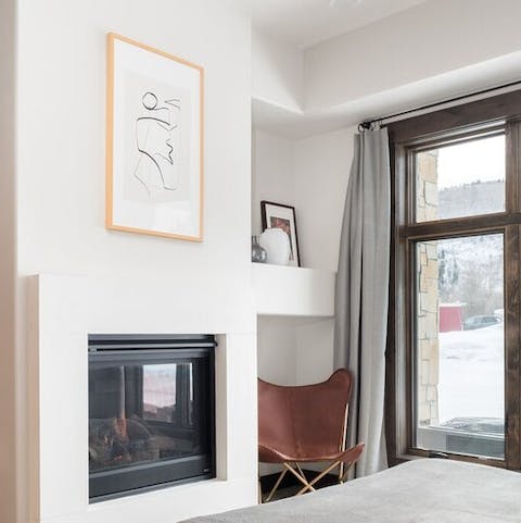 Warm up by the bedroom fireplace with your favourite book