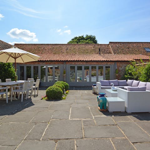 Open up the French doors and make the most of the lovely patio