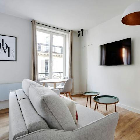 Relax with a glass of French wine in the stylish living room