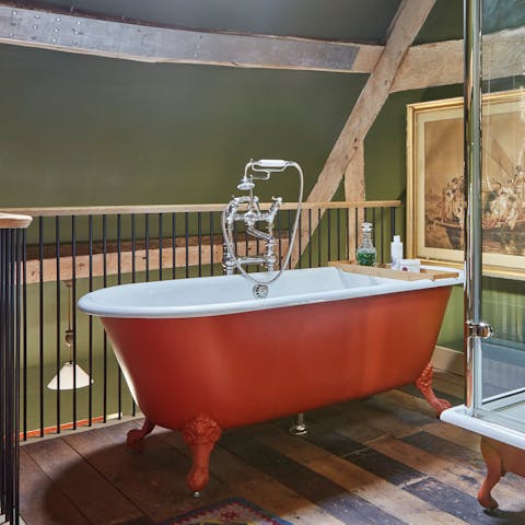 Unwind in the luxurious roll-top bath, part of an en-suite for each bedroom