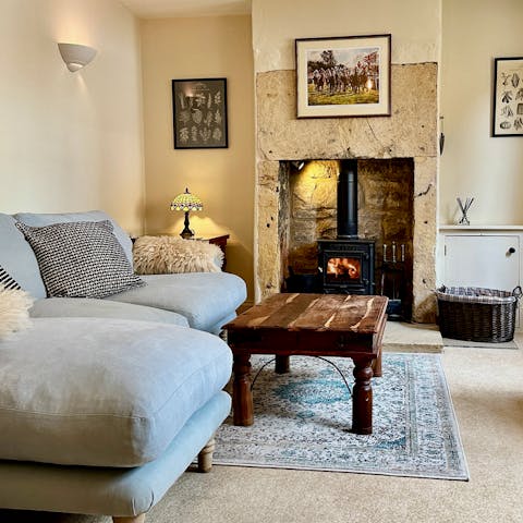Curl up by the crackling fire in winter months, reading a book or playing a board game