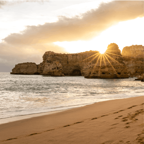 Take a sunset stroll along Praia da Marinha beach, a short distance from the villa