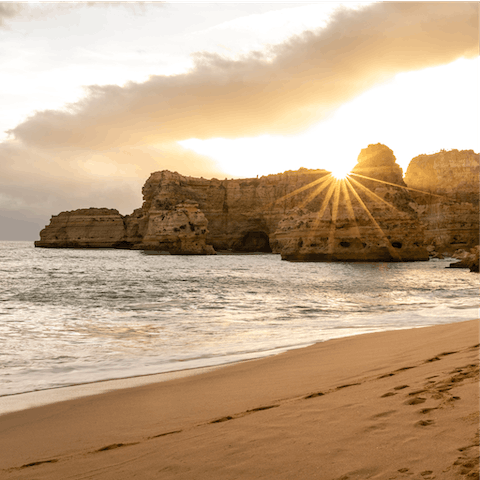 Take a sunset stroll along Praia da Marinha beach, a short distance from the villa