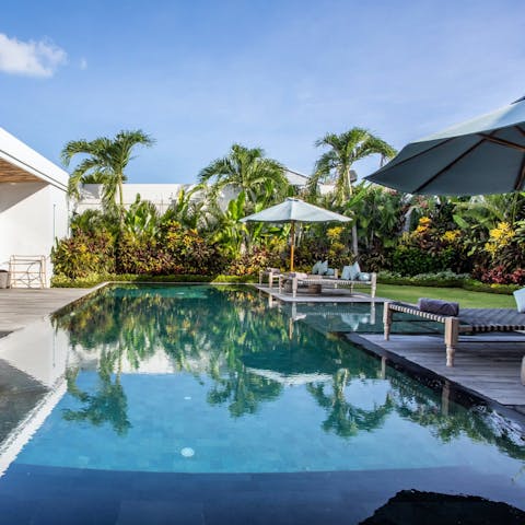Find peace and relaxation while lounging by the pool