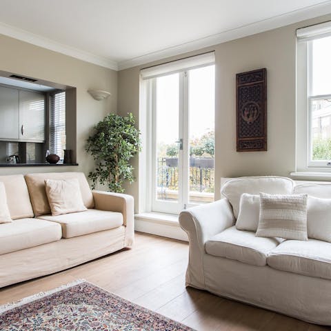 Sink into the cream and white sofas in a light-filled living space