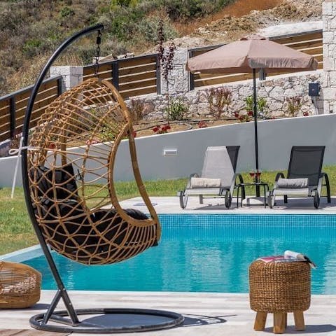 Read books of Greek myths from the comfort of the wicker egg chair