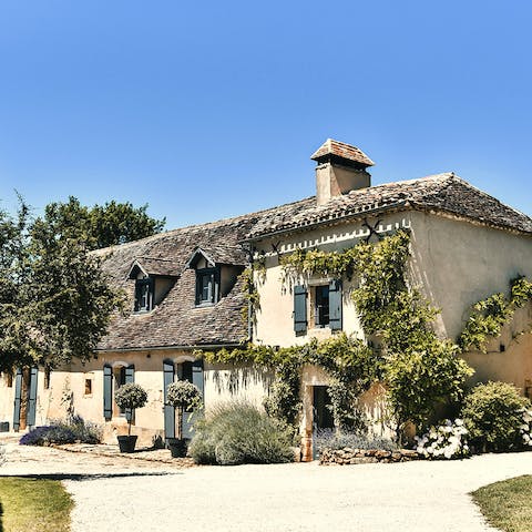 Admire the jasmine climbing the 16th-century stone walls