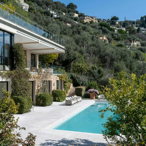 Dive into the private pool amid beautiful plants