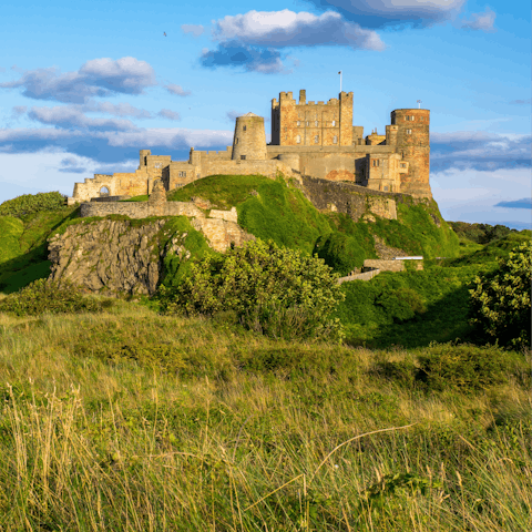 Explore Bamburgh Castle, a six-minute drive from your home