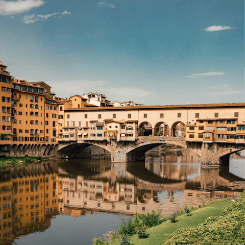 Stroll across Ponte Vecchio with a gelato in hand
