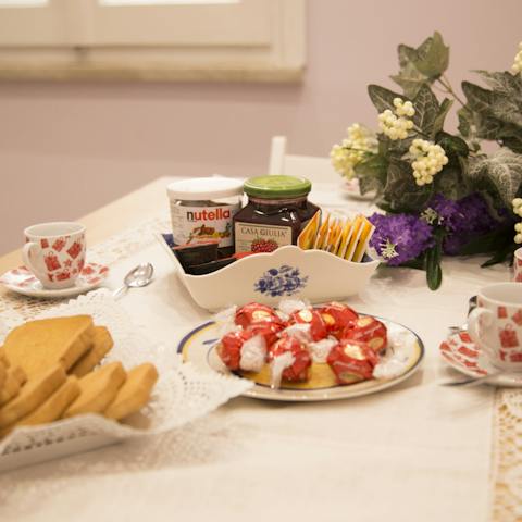 Tuck into a traditional breakfast of bread, butter, and jam at the kitchen table