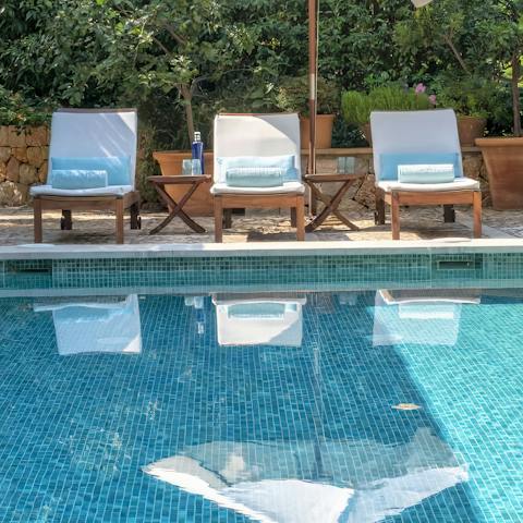 Stretch out on the poolside loungers with a fresh juice
