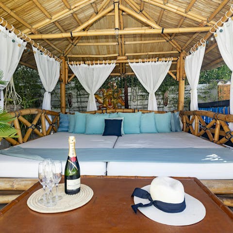 Stretch out on the Balinese daybed with a glass of something refreshing