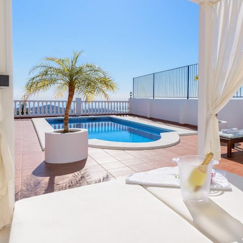 Soak up the rays in style on the day bed with a chilled bottle of Prosecco ready to be popped