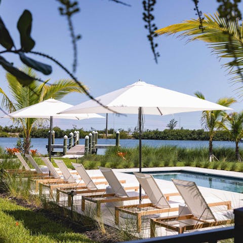 Relax in the private pool with a stunning view of the marina