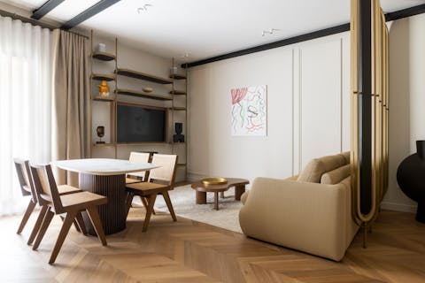 Enjoy a glass of rosé in the chic living room after a busy day