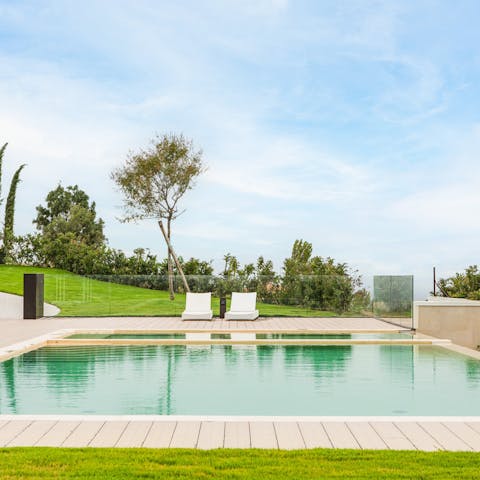 Savour lazy days beside your own private swimming pool