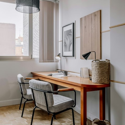 Send some emails at the desk while away in Madrid