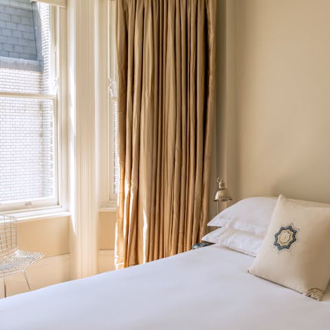 Wake up to natural light flooding in through the bay window
