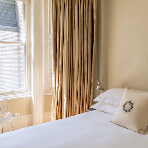 Wake up to natural light flooding in through the bay window