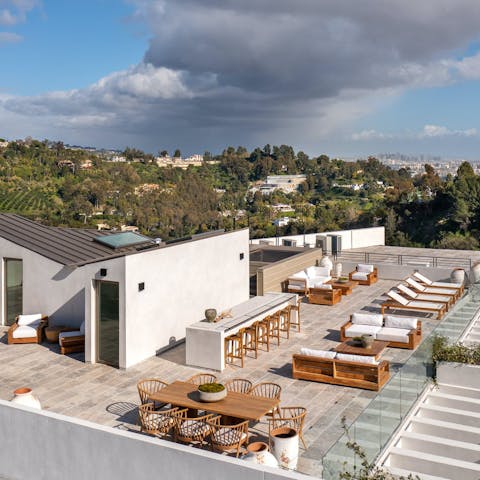 Toast the sunset or catch some rays on the rooftop terrace