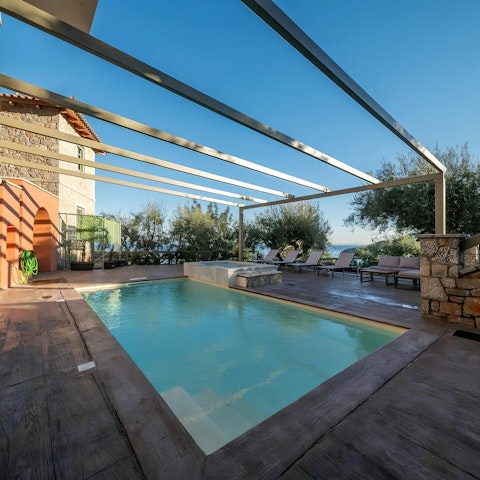 Savour the Greek sunshine from the three swimming pools