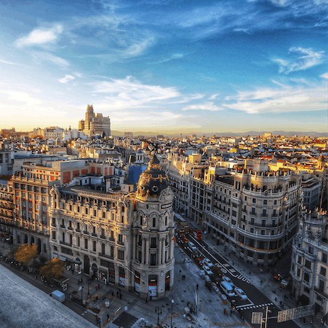 Go shopping along Gran Vía, a three-minute walk away