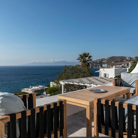 Sip on sundowners as the evening draws in and the sun sets over the sea