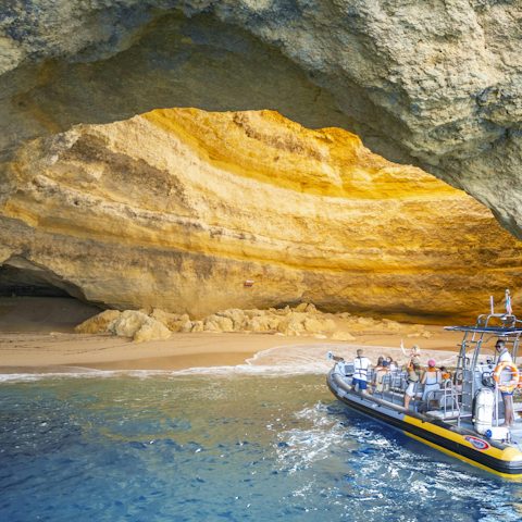 Hop on a boat and explore the iconic Benagil Cave nearby
