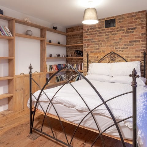 Pick a book from the curated collection in the second bedroom