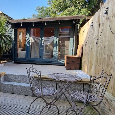 Sit in the private garden on a sunny day