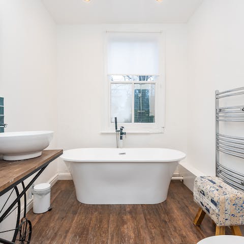 Unwind after a long day of exploring in the luxurious free standing bath