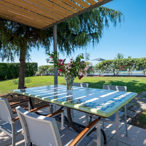 Enjoy every meal of the day on the covered terrace in the garden