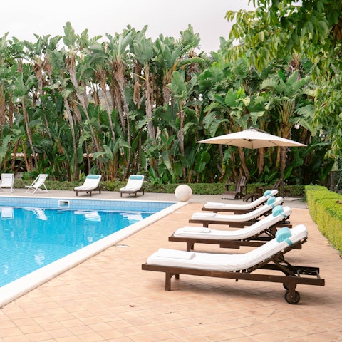 Grab a lounger by the pool and enjoy the sunshine