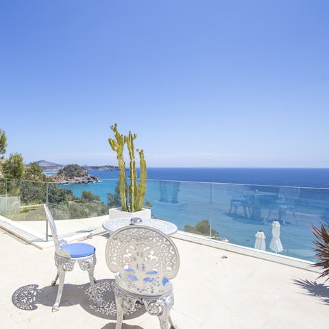 Crack open a bottle of wine as you drink in the sea views