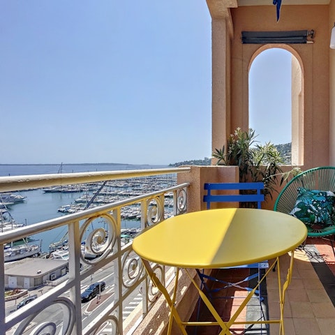 Sip croissants and coffee on the balcony with a view of the harbour